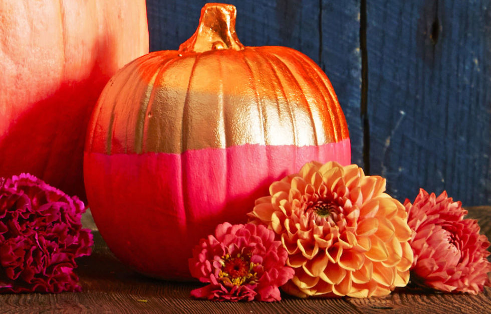 Play with neon hues and metallics for a two-tone pumpkin that makes a bright statement. Brush or dip one half and let dry. Then tape off and color the other half.