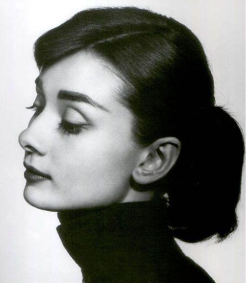 A simple ponytail may seem like a lazy fall-back, but a perfectly straight side part and a bit of glossing serum can give you an Audrey-approved version in minutes.
