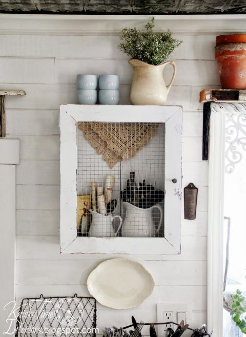 Display your utensils with style (but avoid the wrath of falling dust), by placing chic, white pitchers inside a rustic DIY cabinet.
Get the tutorial at Knick of Time »