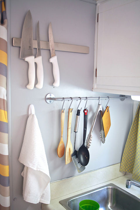 When this family embraced small-space living and moved into a 150-foot camper, they got smart about organizing. A towel bar repurposed as a place to hang spoons and spatulas turns a blank wall into a useful storage spot.
See more at The Noshery »