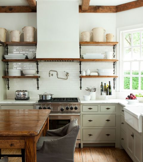 Barbara Westbrook, interior designer and author of Gracious Homes, knows the power of pale hues. She chose Pratt and Lambert's Chalk Grey paint for this kitchen's walls and range hood to brighten the room and impart a sense of openness. See more in Gracious Homes » 