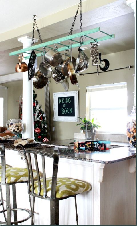 Stop stooping into low cabinets to rifle through your supply of pots and pans. There's a certain ease (and a casual design element) to hanging them overhead. See more at Refunk My Junk » 